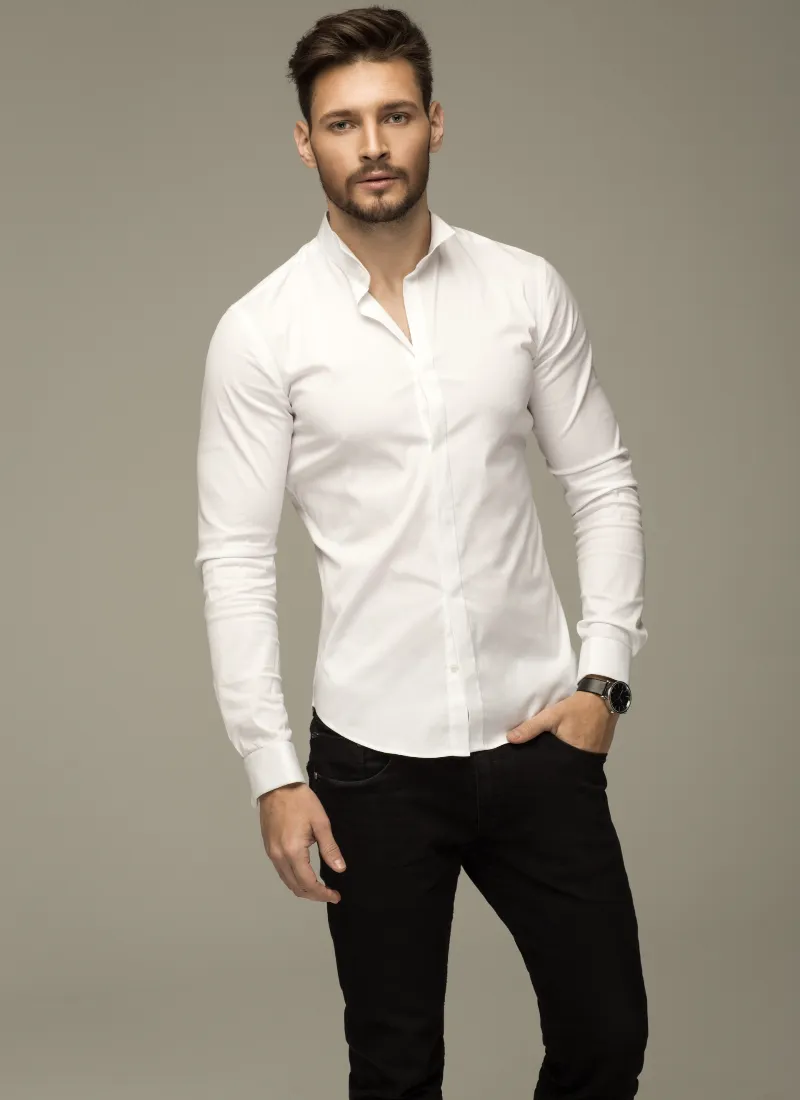 Handsome young man in white shirt and black pants outdoor in city park,  walking toward camera, serious Stock Photo | Adobe Stock